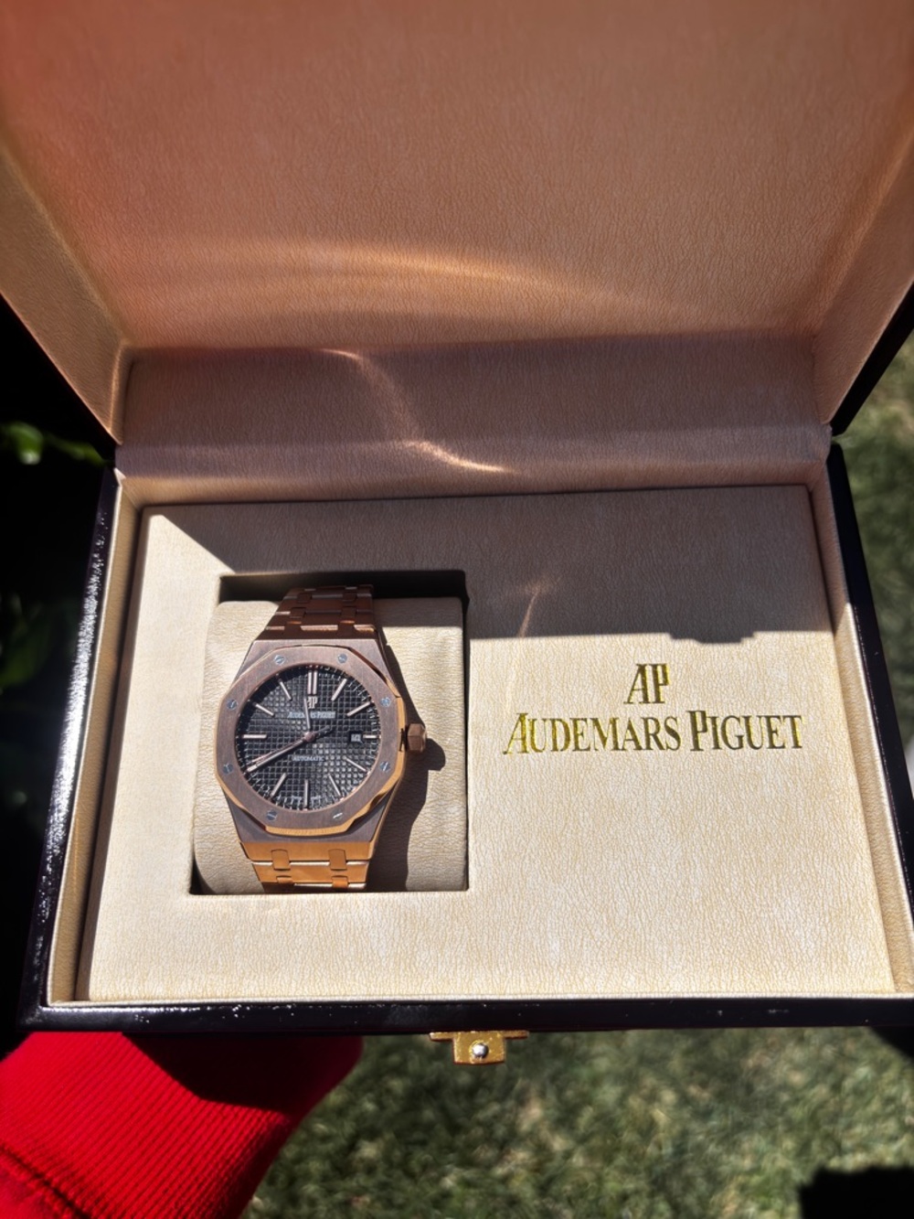 Audemars Piguet Rose Gold Watch with Black Dial and Integrated Bracelet